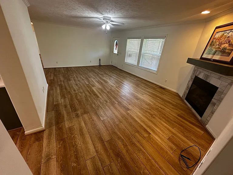 Living area view from exiting master bedroom. Gas fireplace.