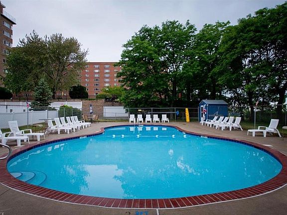 Outdoor pool and grilling area overlooking Lake Erie