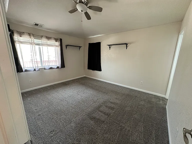 Primary bedroom with attached bathroom