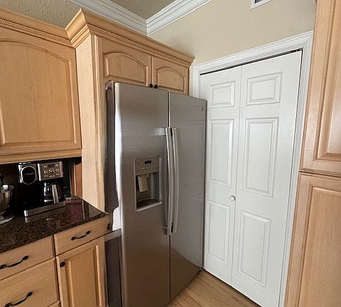 Laundry nook behind sliding door with Full size washer and dryer