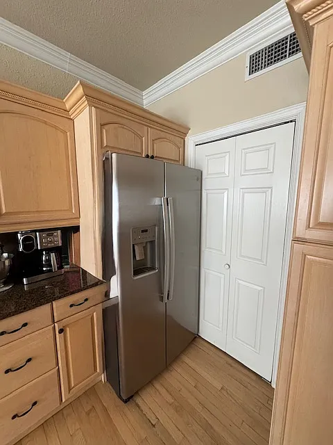 Laundry nook behind sliding door with Full size washer and dryer