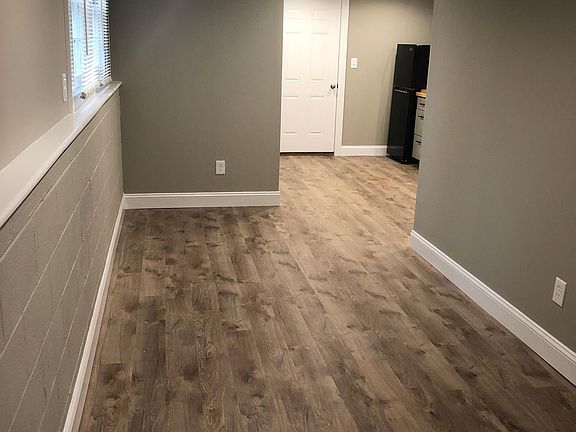 Open concept living/dining space with new flooring through out. Includes double window with backyard view.