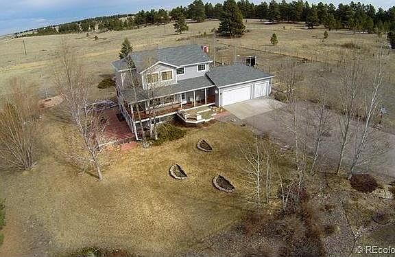 Bright Dining Room W/Hardwoods & Sliding Doors to the Covered Porch