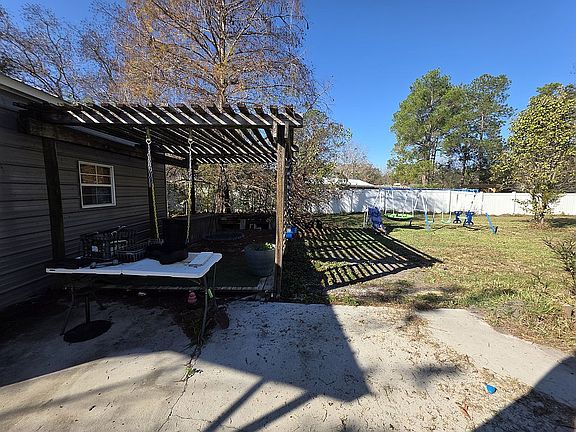 Pergola off concrete patio