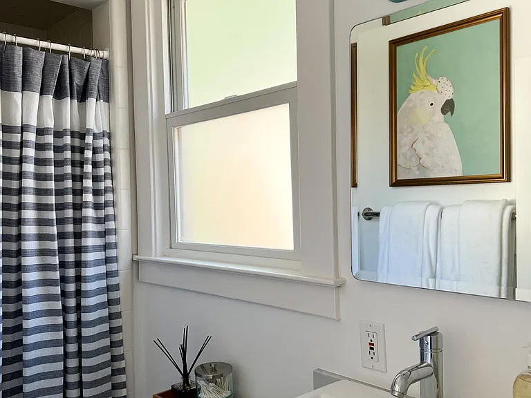 Back bathroom (across the hall from the Garden Bedroom); this bath has a stall shower and custom single vanity.