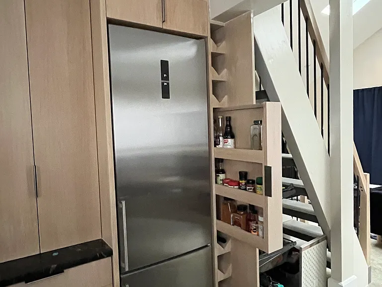 Pantry; tall fridge; hidden spice, & built in wine rack.