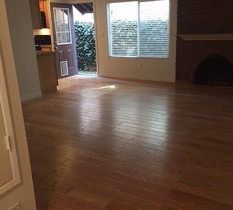 Living room with fireplace and door to side yard