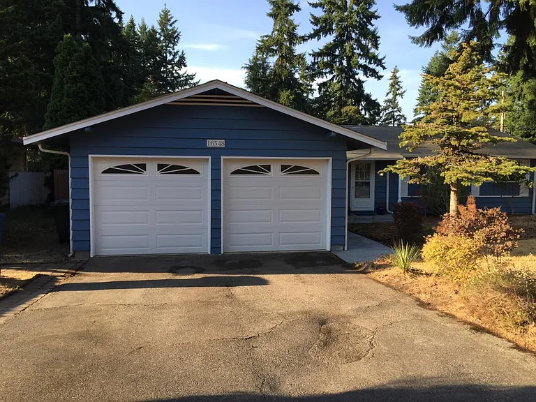 dual metal garage doors and house freshly painted