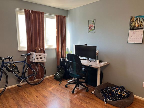 Bedroom that we use as an office. Large, west-facing windows