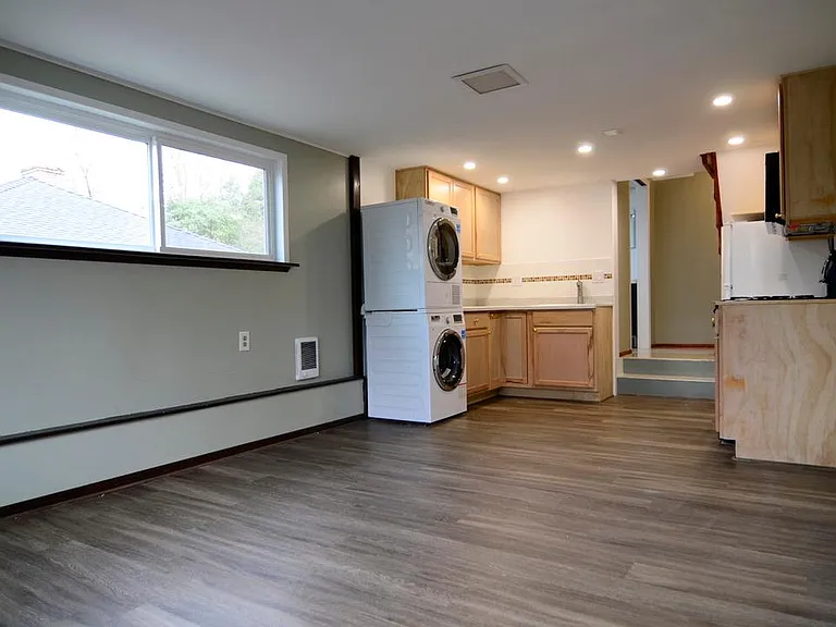 All new windows, floor, separate electric heat in each room, newer washer/dryer, kitchen cabinets, microwave, refrigerator, etc.