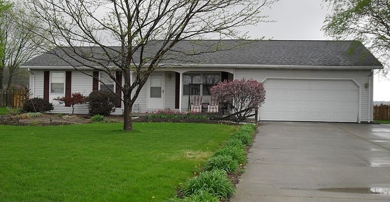 Home has three bedrooms, 1.5 baths, and a pond in the back yard.