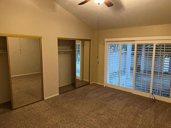 Large bedroom with Sliding door to fenced rear yard.