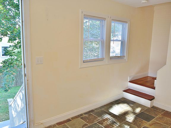 Mudroom entrance, stairs leading to main level of unit.