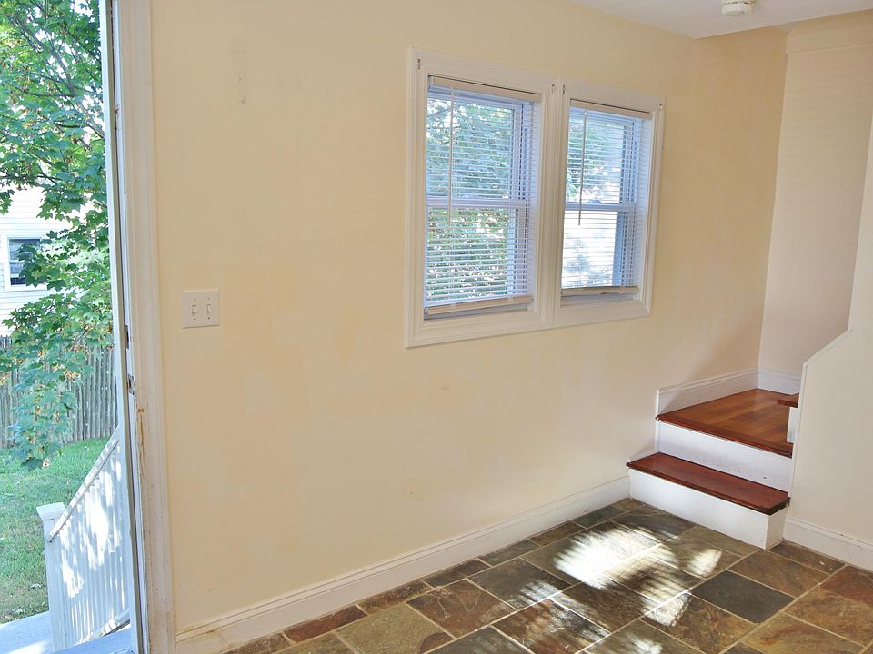 Mudroom entrance, stairs leading to main level of unit.