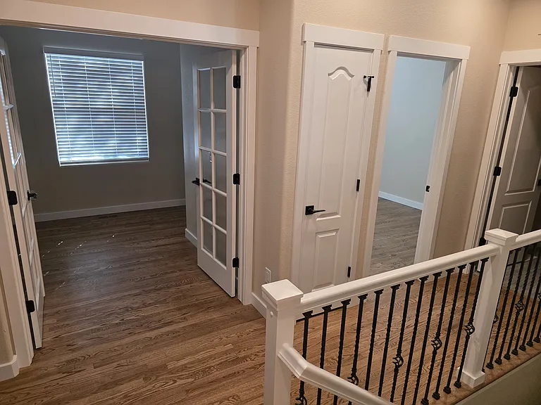 Hall upstairs with stairway to basement