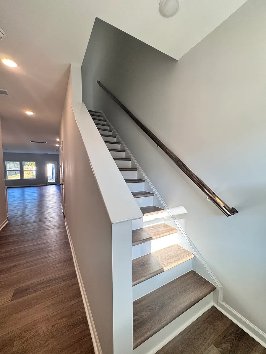 First step in, hallway to the kitchen & living room (left), stairs up (right) - 3121 Ranger Dr #40
