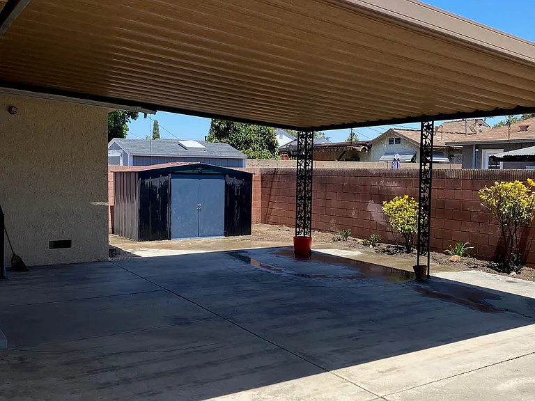 Side yard view looking into storage shed