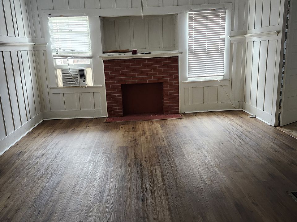 Living Room. New flooring. Fireplace with mantel for show.