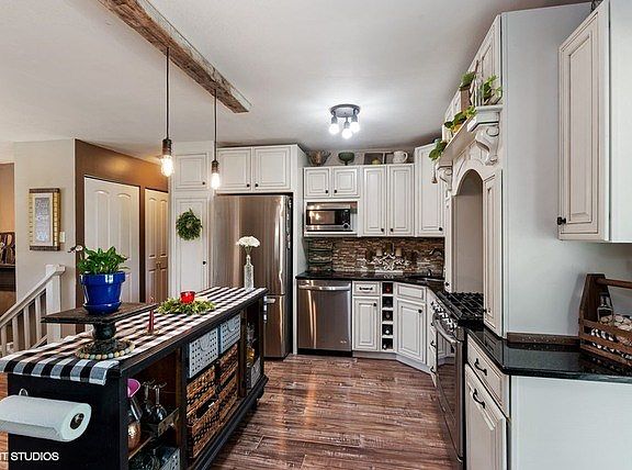 You will love this kitchen! Complete remodel in 2016! Custom cabinetry, granite, stone and glass bac