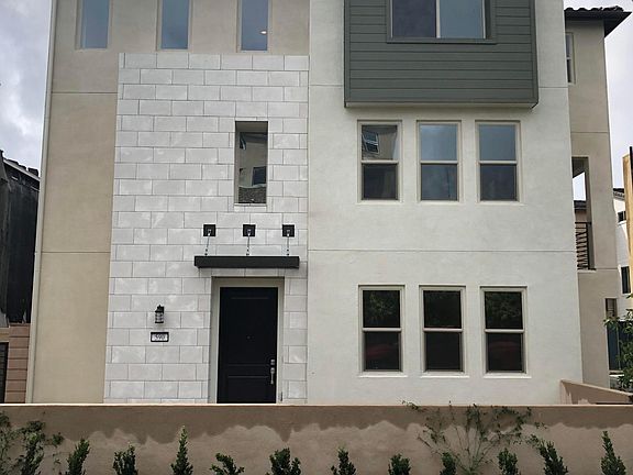 Front view of the home at new construction point. Mature custom landscape offers more privacy now...