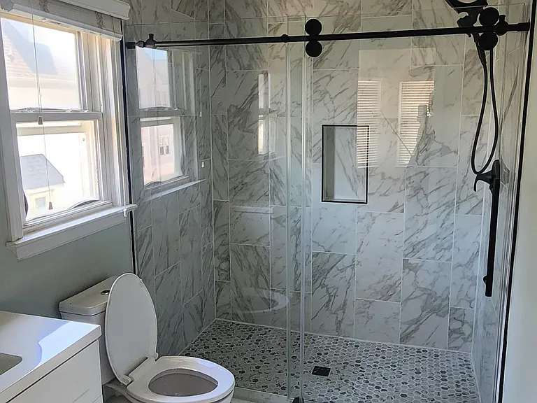 Fully renovated master bathroom with tile walls and floors & new vanity