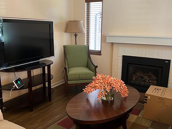 living room with remote gas fireplace for warm winter nights