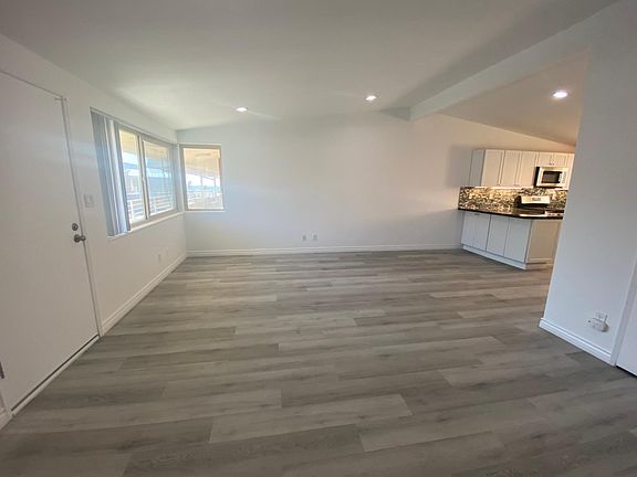 Huge living room with higher ceiling and lots of windows for light and air. Ocean peak