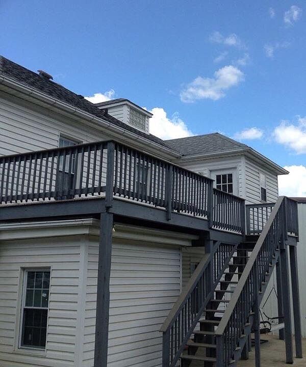 Apartment entrance with deck facing wooded area