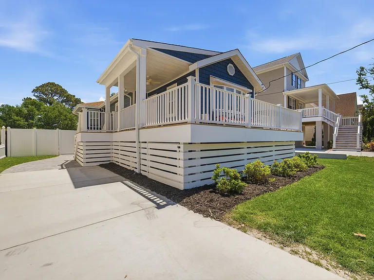 View from the driveway showcasing the front of the home.
