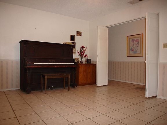 Formal living room with tile flooring.