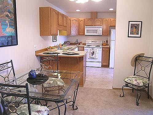 The dining room is near the kitchen for easy access. There is room for a table to expand for family dinners or to have a small table. The breakfast bar can be used with bar stools or without, depending upon your choice. The cable and phone outlet is re