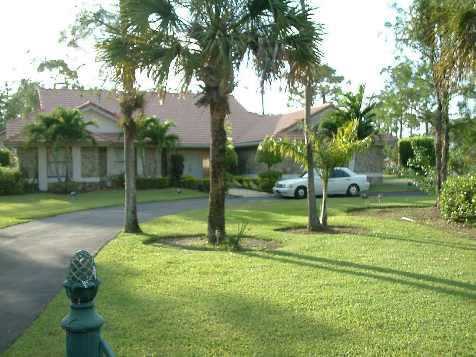 Home is well away from street on 1+ acre lot