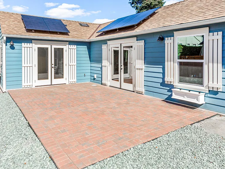 This photo was taken before the fence and landscaping + the tree were added