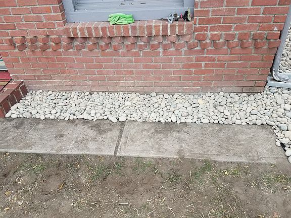 River rock along house