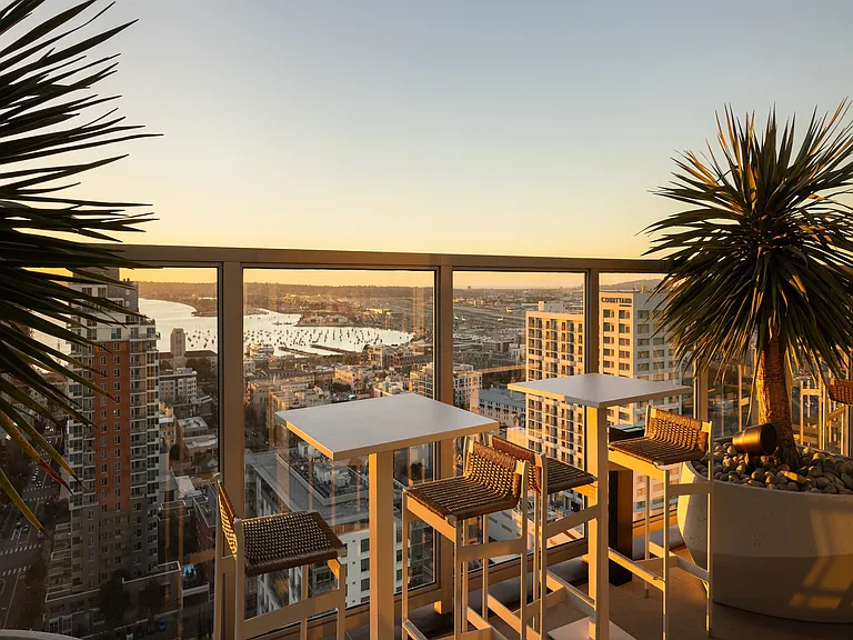 Breathtaking cityscape view from a modern terrace, featuring stylish seating and lush greenery, perfect for sunset relaxation.