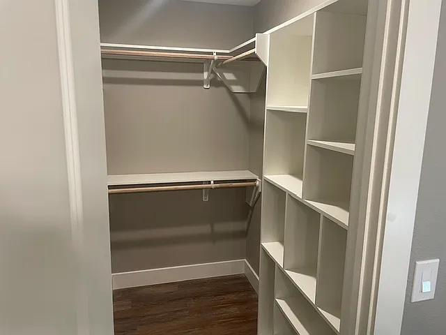 Closet for bedroom 4 also serves as a linen closet with shelving.