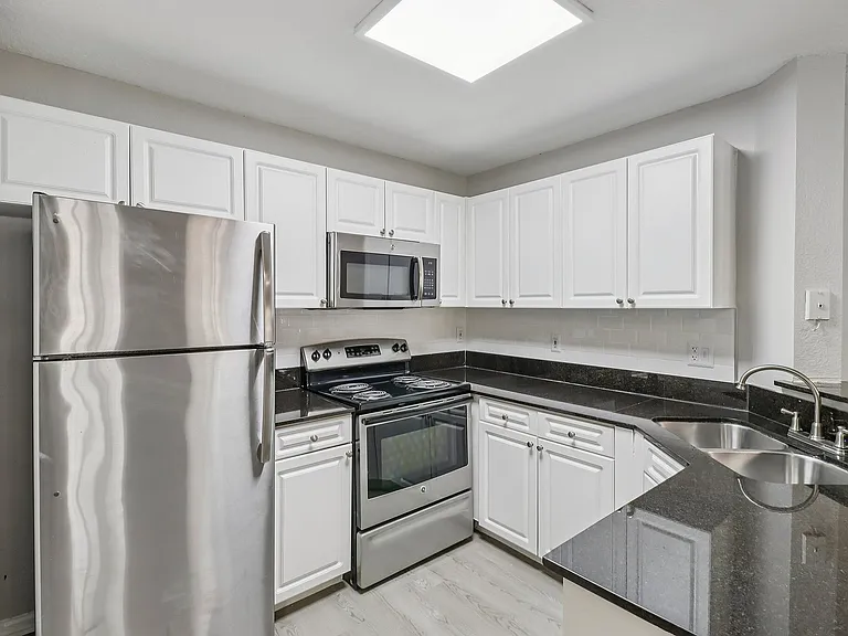 Modern kitchen with sleek finishes and convenient breakfast bar