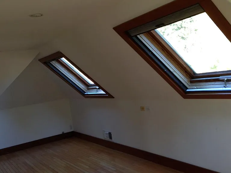 Upstairs bedroom with skylights