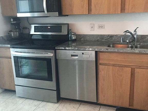 Kitchen with stainless steel appliances.