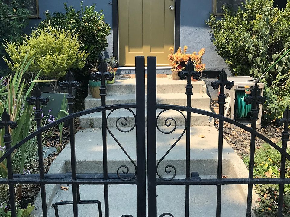 Front garden with flowers and raised vegetable beds