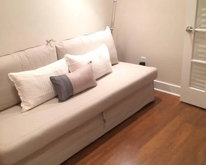 Sofa-bed in den and French doors with blinders (right)