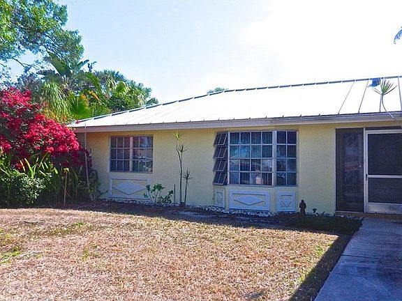 Front entrance and walkway from driveway to garage.