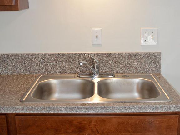 new stainless sink with above cabinet light