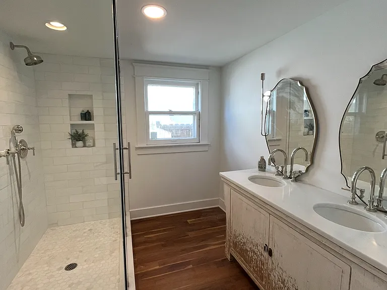 Master bathroom with LUX Restoration Hardware fixtures throughout, including double sinks and double showers.