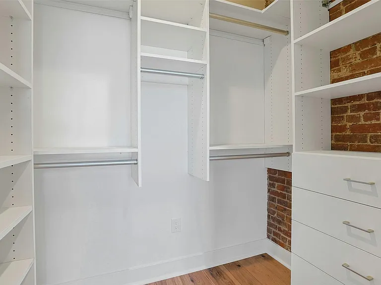 Walk-In Closets: Large walk-in closet with plenty of storage space.