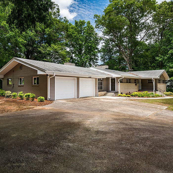 Large driveway with 2 garages