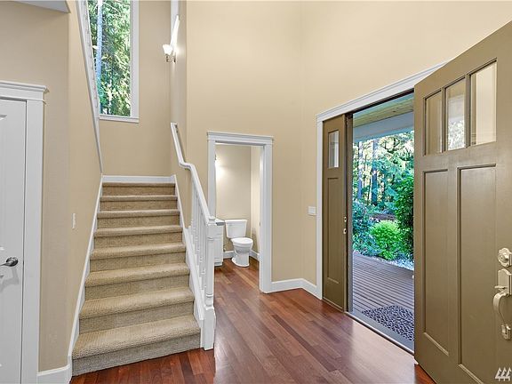 And to the left of the door are the carpeted stairs. 