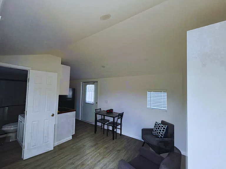 Cozy and bright studio featuring a cozy bed, kitchen, bath & living area
