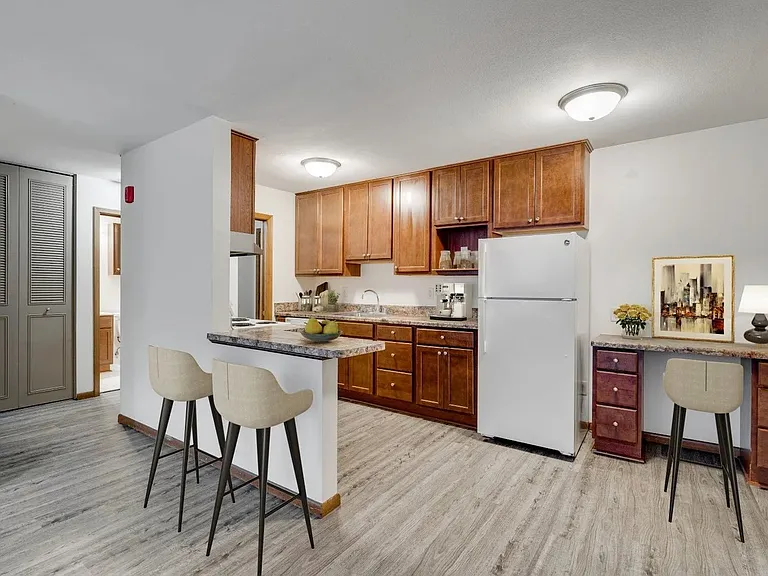 Welcome to Central Lakes of Uptown, where modern living meets comfort. This stylish kitchen features sleek cabinetry, updated appliances, and a cozy dining area. Elevate your lifestyle today! Schedule a tour to see your new home!
