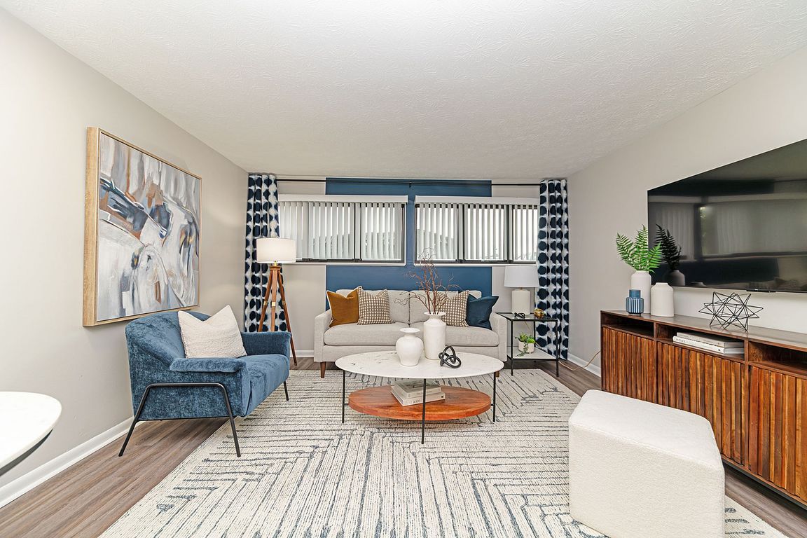 Spacious living room with hardwood-style flooring